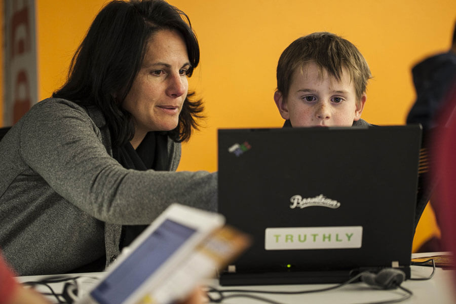 Parent with kids at desk